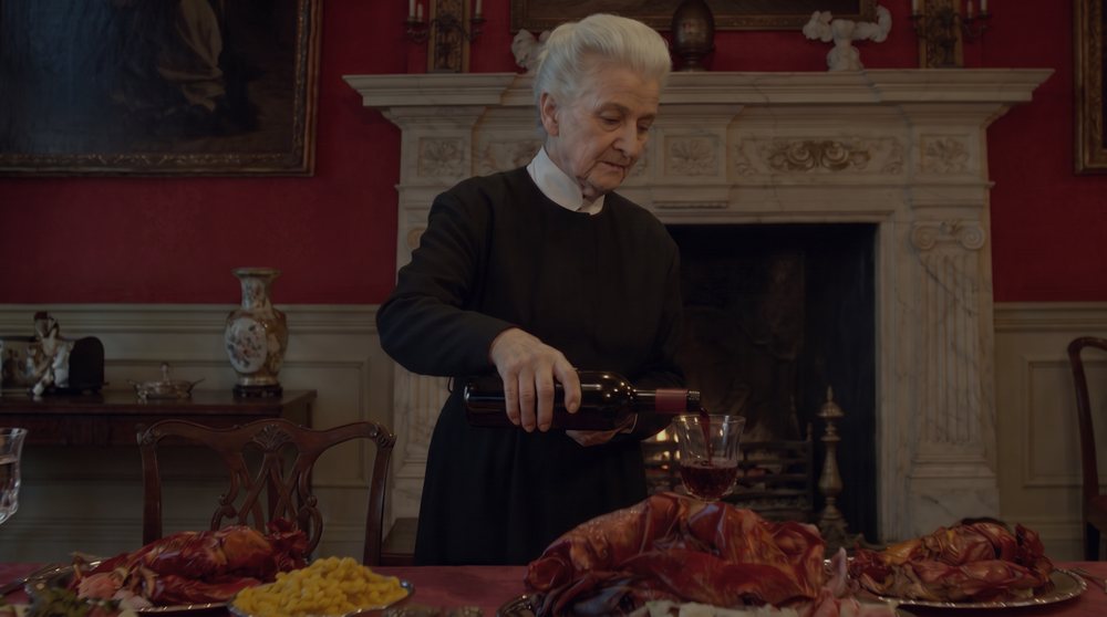 Result: the feast stays, the room returns to the reference's dark, moody color