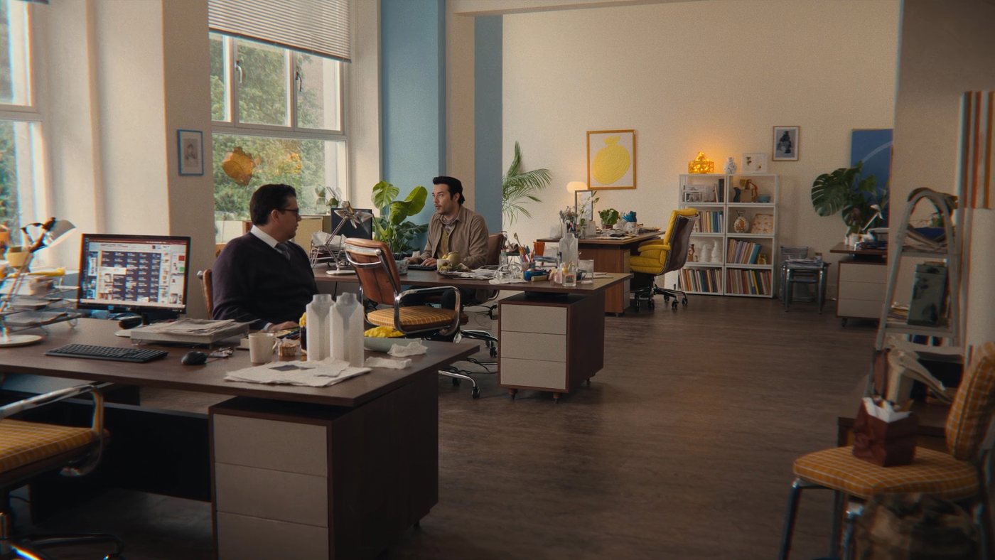 Reference shot of the office in a warm golden grade